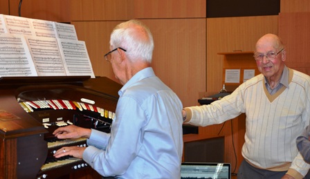 Alan Glover (right) with the Wurlitzer Organ, 2015.